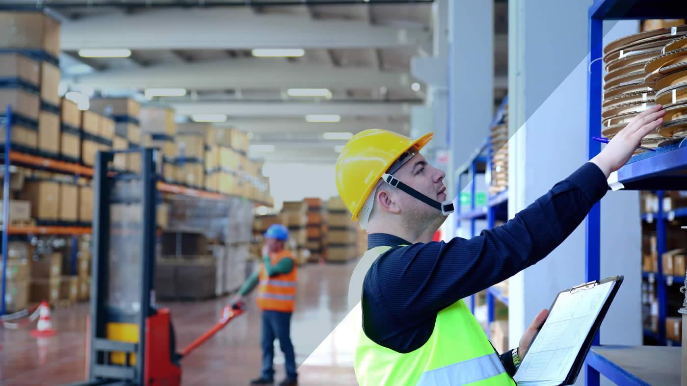 Hard hatted worker in warehouse