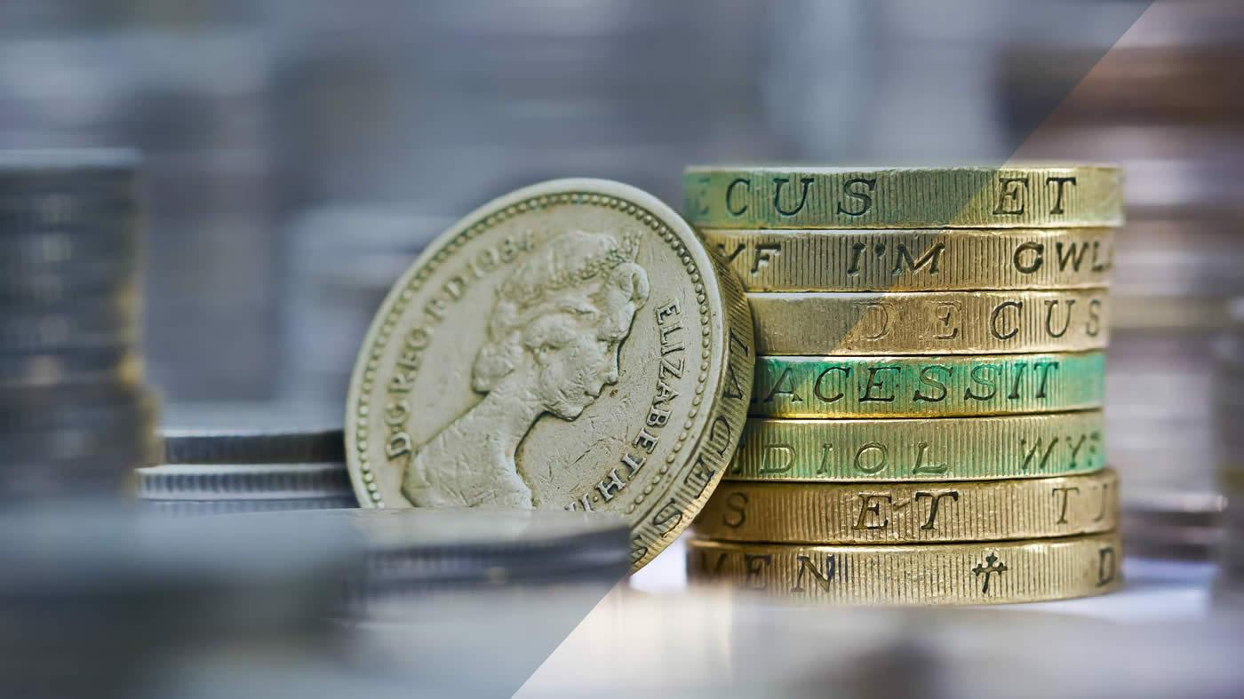 Pound coins stacked