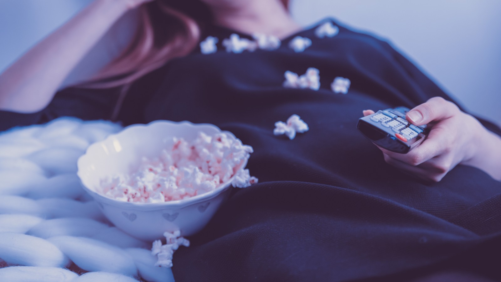 Watching film eating popcorn