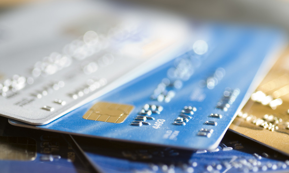 Pile of credit cards, narrow focus.