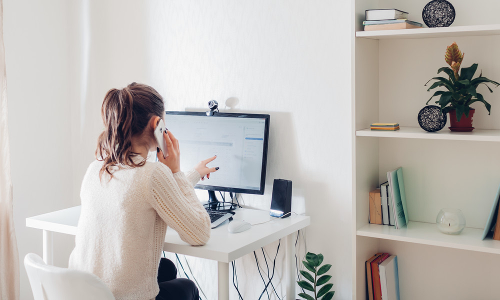 Work from home during coromavirus pandemic. Woman stays home. Workspace of freelancer. Office interior with computer