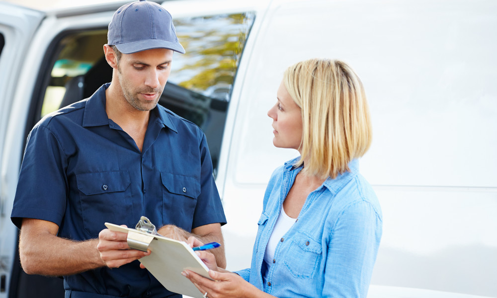 Women signing for delivery