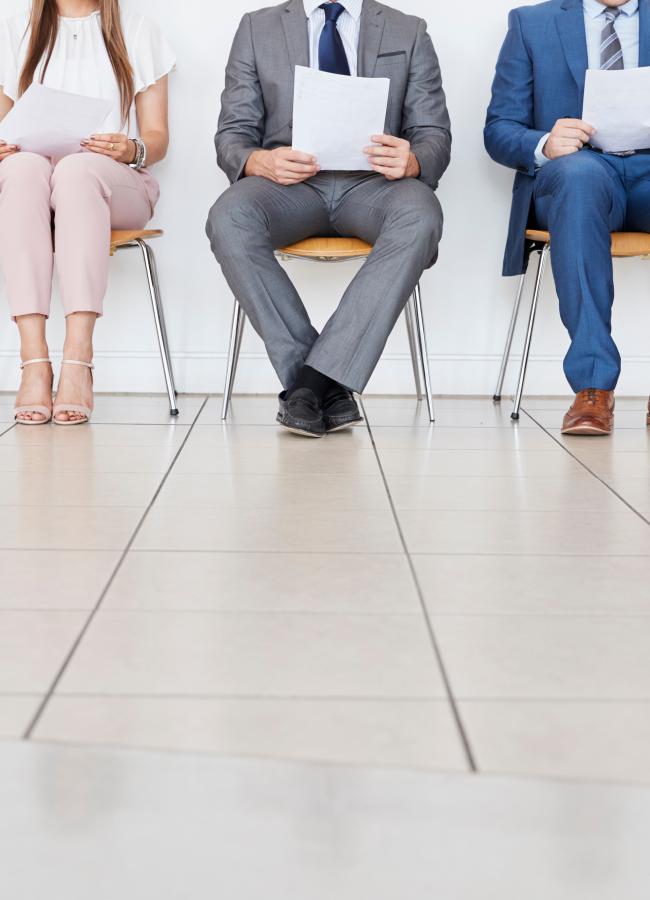 Job candidates in a line waiting to be interviewed